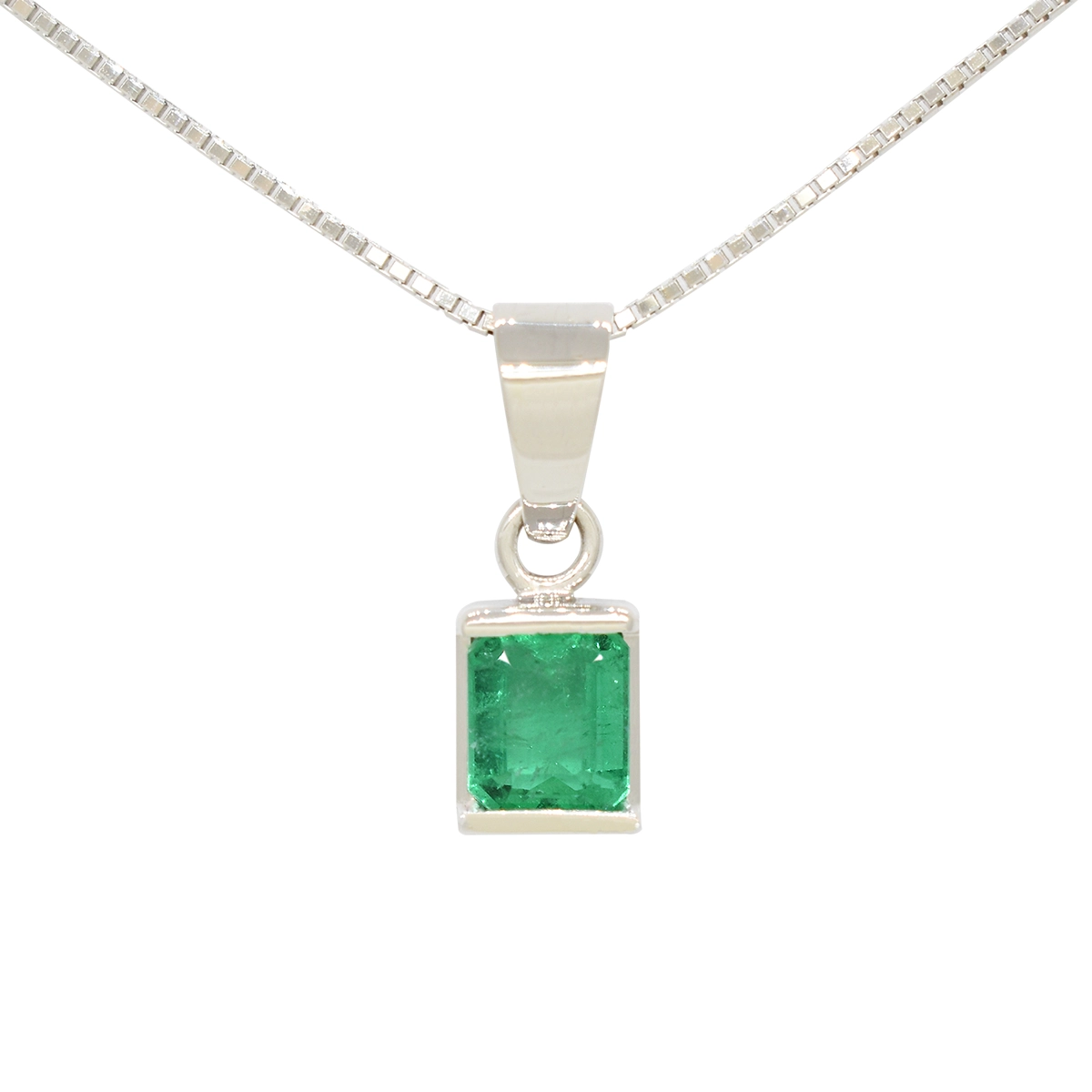 Emerald-cut natural Colombian emerald in 18K white gold pendant necklace half bezel solitaire style