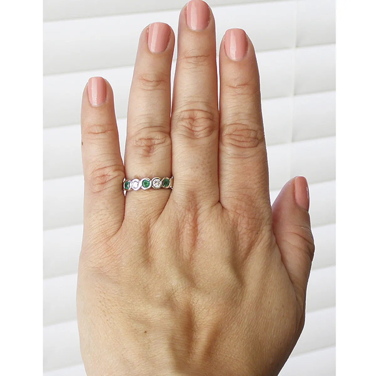 emerald_band_ring_with_diamonds_white_gols_bezel_setting.webp