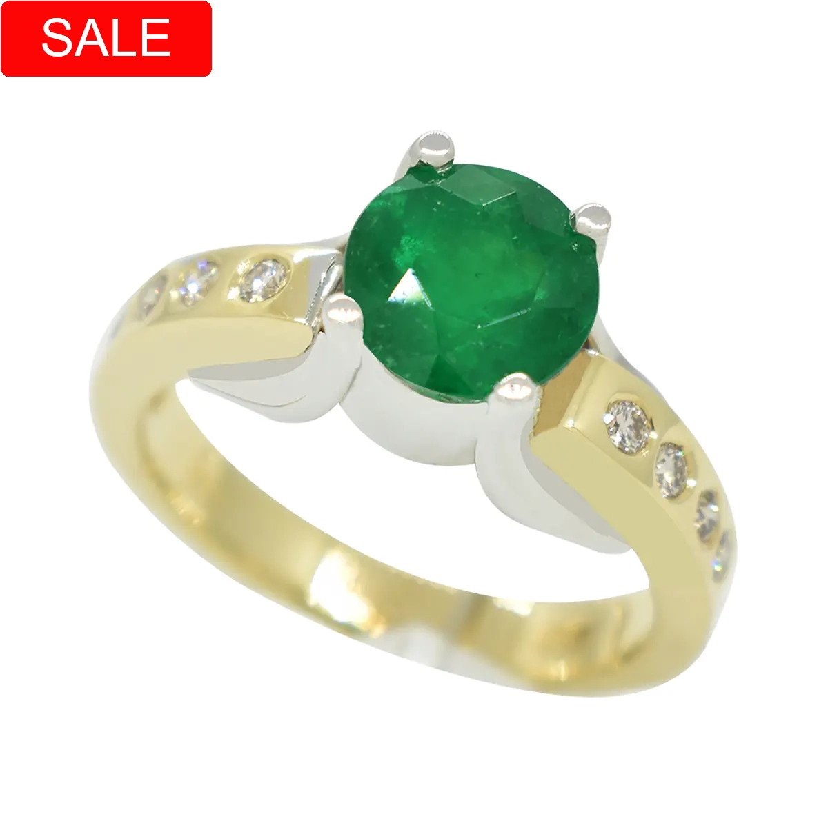 Two-tone emerald and diamond ring in 14K gold with a round-cut emerald set in white gold prongs and eight round-cut diamonds embedded in the yellow gold shank