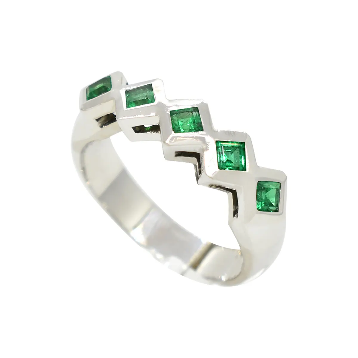 This emerald band ring features 5 brilliant green color emeralds set in wide and smooth bezels with a highly polished surface that creates a nice frame for each gem