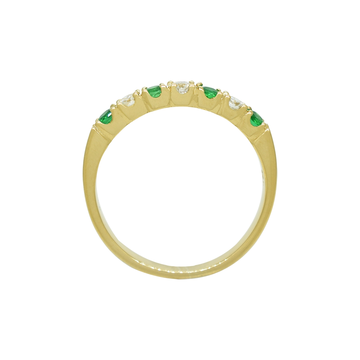 Both the emeralds and diamonds are set in a classic prong setting that holds each stone securely in place while allowing full light to enter and enhance their brilliance