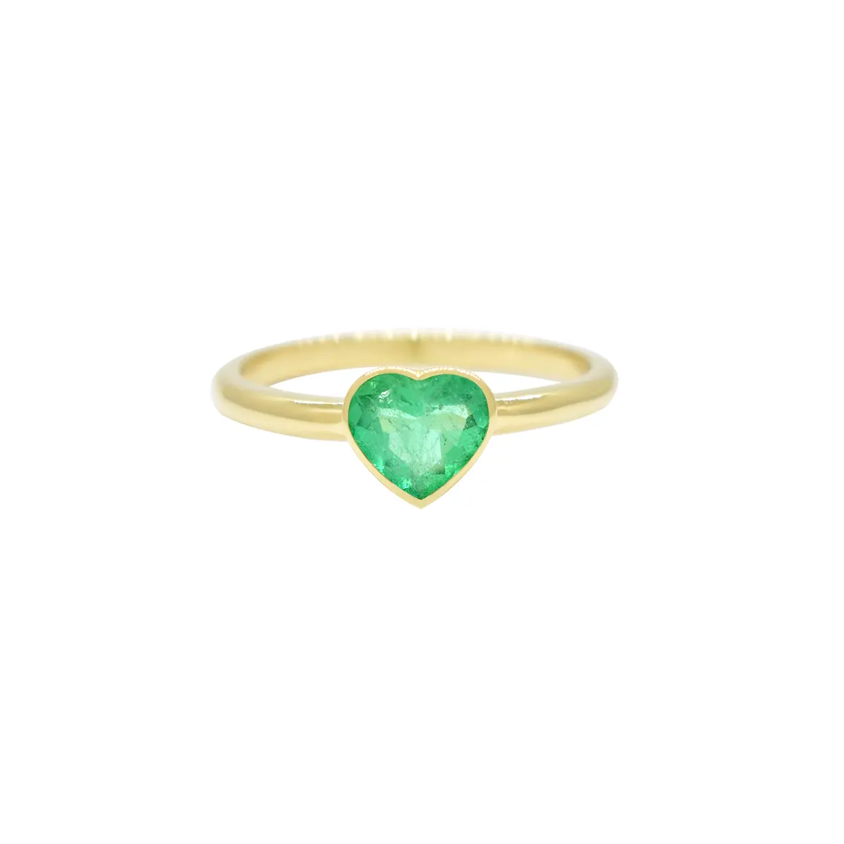 This solitaire ring features smooth lines and a serene green color from the heart shape emerald that is perfectly framed in a polished bezel