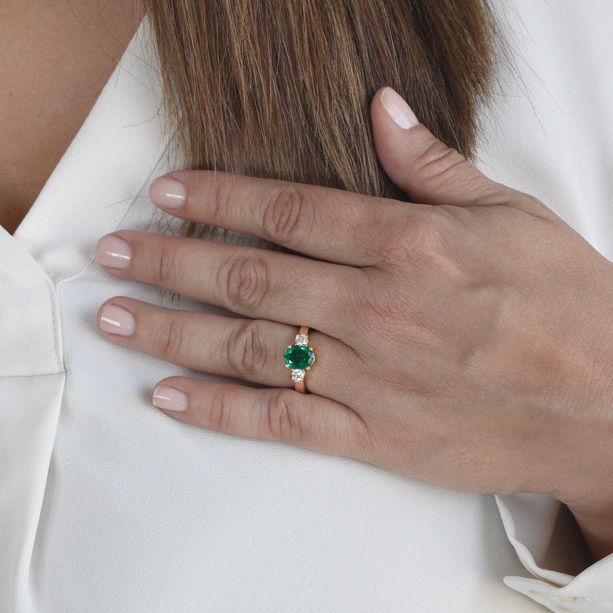 This diamond and emerald ring is ideal for an engagement or anniversary ring, representing a lasting commitment and the journey of love