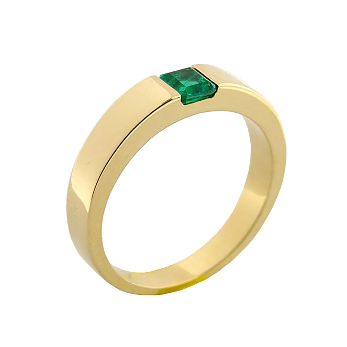 This is a small men's wedding band ring made of 18K yellow gold. It features a green emerald cut emerald embedded inside the shank of the ring