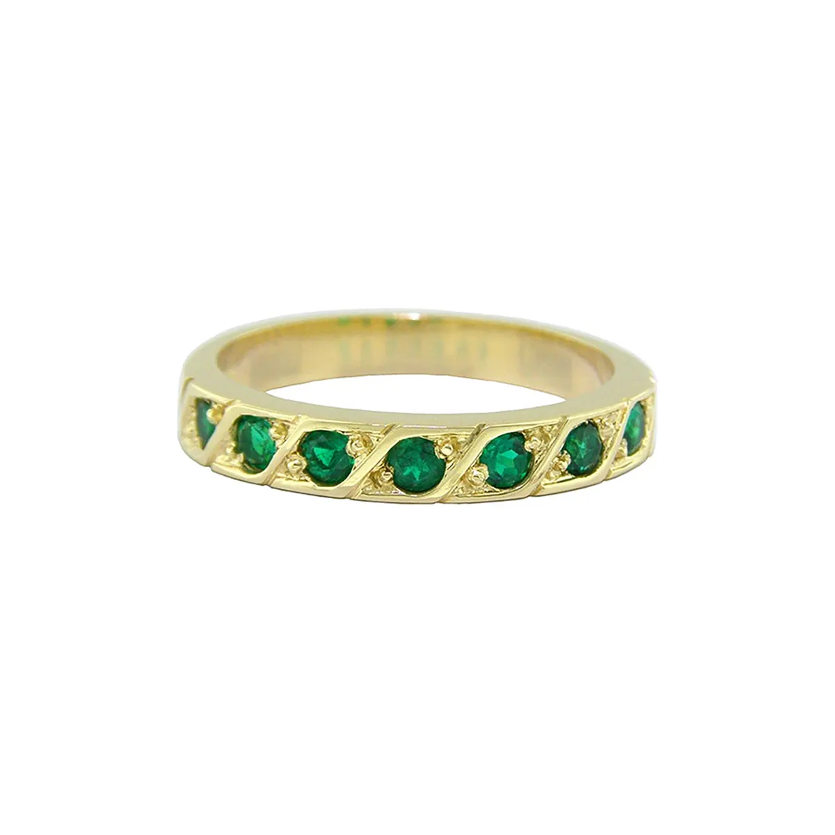 The width of this emerald band is 3.2 mm. The diameter of the round cut emeralds is 2.3 mm, and they were carefully selected for their quality and green hue